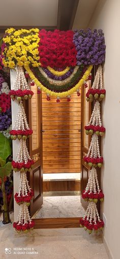 a doorway decorated with flowers and beads