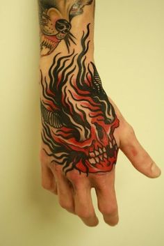 a person with a tattoo on their hand