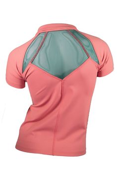 the back of a woman's pink top with mesh detailing on the shoulders and shoulder