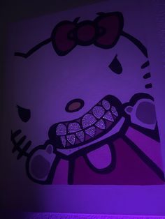 an image of a hello kitty painting on the wall with purple light in the room