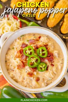 a bowl of dip with bacon, cheese and jalapenos on the side