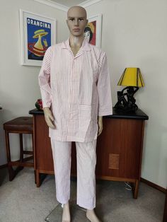 I'm listing a lot of mens sleepwear and this pair is Australian made by the Davenport label in a pink and white ticking stripe cotton. It is label a size small and is in good condition, maybe unworn. The top is shirt style with a huge hip pocket and long length, oversized loose and cool for summer. The pants have a two button fly front and elasticed waist, long ankle length pants. Measurements are Top  chest 112cm Length shoulder to hem 82cm Pants  Waist relaxed 74cm Stretched comfortably 86cm L Pink Sleepwear With Pockets For Summer, Mens Pajamas Pink, Striped Long Sleeve Sleepwear In Relaxed Fit, Striped Long Sleeve Sleepwear With Relaxed Fit, Pink Sleepwear With Pockets In Relaxed Fit, Striped Relaxed Fit Sleepwear For Home, Striped Cotton Sleepwear With Relaxed Fit, Relaxed Fit Striped Sleepwear For Home, Huge Hips