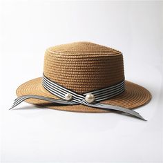 This absolutely perfect straw hat is the perfect compliment to any summer and spring outfit. This gorgeous woven pattern and color accessorize your look perfectly with a fabulous silk black or striped ribbon. Come in nine fabulous colors and styles. Striped Sun Hat For Spring Vacation, Summer Beach Hat With Stripes, Adjustable Striped Straw Hat For Vacation, Striped Sun Hat For Spring, Spring Striped Adjustable Hats, Adjustable Striped Hats For Spring, Striped Summer Hats For Vacation, Spring Adjustable Striped Hats, Summer Striped Vacation Hat