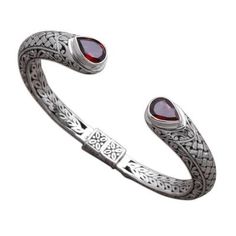 Resembling a weave intricate patterns in sterling silver circle the wrist with elegance. Balinese artisan Giri Tasmana creates this cuff bracelet which culminates in faceted teardrops of garnet that total 2.5 carats altogether. This bracelet opens with a concealed hinge to fit the wrist. Sterling Silver Cuff Bracelet With Intricate Design, Elegant Oxidized Finish Cuff Bracelet For Formal Occasions, Bohemian Sterling Silver Bracelet For Formal Events, Bohemian Sterling Silver Bracelet For Formal Occasions, Garnet Bracelet, Silver Circle, Sterling Silver Dangle Earrings, Silver Art, Jewelry Online Shopping