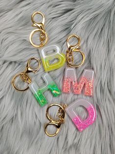 4 neon colors to choose from yellow, green, pink and orange, Lobster clasp chain Free Shipping Across Canada (No tracking, but can upgrade at cost for tracking) Letter Keychain Resin, Resin Letter Keychain Ideas, Resin Keychain Ideas, Resin Letter Keychain, Diy Resin Keychain, Resin Letters, Keychain Resin, Keychain Craft, Letter Keychain