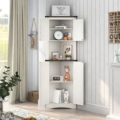 a white corner bookcase in a living room