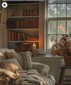 a living room filled with lots of furniture and bookshelves next to a window