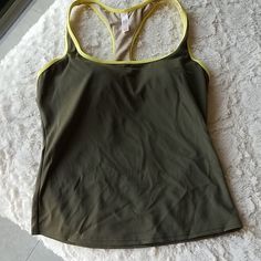 Olive Color, Never Worn. Tags Are Cut To Prevent Store Returns. There Is A Built In Padded Bra . 1 Small Hole And Q Small Snag From Storage. Both Inside And Not Visible When Worn. Tankini Swim Tops, Swim Tankini, Padded Bra, Olive Color, Victoria Secret Swim, Swim Top, Womens Swim, Tankini, Built In