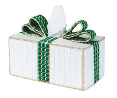 a wrapped present box with green and white ribbon