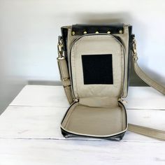 a white purse sitting on top of a table