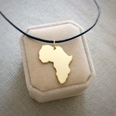 "18kt Gold Plated Africa Necklace, Big size, Golden Heart Africa Ethiopia Pendant Adoption Necklace in a kraft gift box with an Extra Free Gift. ✿Let your heart bring you to places you most love with our jewel maps✿ ✿ JEWEL ✿ PENDANT SIZE: 3x2.5 cm ( 1.2x1 inches). 0.7 mm Thick CHAIN: Now with 18kt gold plated sterling silver chain from 16\" to 18\" aproximately. Please, look the picture. The chain size is exactly 40cm (15 3/4\") and 45cm.m (17 23/32\"). Or 1.5mm leather cord. Ready to ship in 1 Africa Pendant, Jewel Pendant, Africa Necklace, Necklace Big, Map Pendant, Golden Heart, Africa Map, Gold Plated Sterling Silver, Big Size