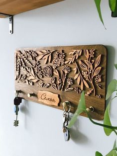 a wooden key holder is hanging on the wall