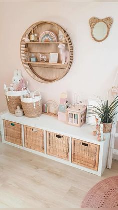 there are baskets and toys on the shelf in this room, along with other items