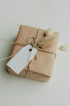 a wrapped gift with a tag tied to it