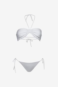 The Shell bikini by Sara Cristina features a seamless top with no hardware for a second-skin fit. It is adjustable at the back and the neck. It is accompanied by our classic string bikini bottom. 80% Polyamide, 20% ElastaneMade in USAModel is 5'7" (170cm) and wears a size S Beyonce Bathing Suit, Cute Swimwear, Luxury Swimsuits, Swimsuit Inspo, White Bathing Suit, Tropical Bikinis, Seamless Top, Swimsuits Outfits, White Bikinis