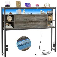 an entertainment center with shelves and pictures on the wall above it, along with a usb cable