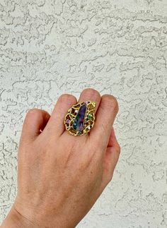 Behold this exquisite statement ring, crafted with a unique Australian boulder opal, set in a modernist organic floral head of solid 18K gold. Its colorful and intricate design is perfect for the luxury-seeking trendsetter, ready to make a bold statement of exquisite taste. ♥ The face of the ring measures 21.4mm in width, 27.6mm in length, and sits 7.8mm tall from the finger. The band is about 4.3mm wide. ♥ US size 7 (Free resizing up or down 1 size)♥ Material: 18k yellow gold; weighs 14.2g ♥ Ge Unique Opal Ring With Gemstone Accents, Unique Multi-stone Opal Ring In Gold, Unique Gold Opal Ring With Multi-stone, Unique Yellow Gold Opal Ring, Australian Boulder Opal, Opal Engagement, Chunky Rings, Engagement Rings Opal, Gold Ring Sets