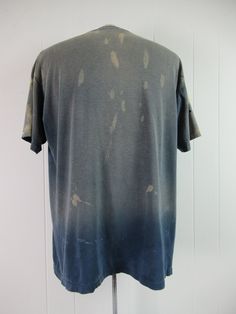 "Vintage 1980s blue cotton sports t shirt with white and yellow graphics. Eggleston's Softball Complex Champions. Has distressed paint all over and very sun faded. Size XL. Actual measurements are: 47\" around the chest 47\" at the waist 21.5\" shoulder seam to shoulder seam 29\" overall length" Pre-washed Relaxed Fit T-shirt For Streetwear, Pre-washed Short Sleeve Tops For Summer, Vintage Pre-washed Cotton T-shirt, Distressed Cotton Crew Neck T-shirt, Pre-washed Short Sleeve Grunge T-shirt, Vintage Faded T-shirt Pre-washed, Pre-washed Crew Neck Graphic Tee, Vintage Faded T-shirt With Screen Print, Faded Relaxed Fit Short Sleeve Tops