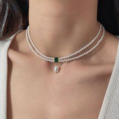 ✦ 𝐈𝐭𝐞𝐦 𝐃𝐞𝐬𝐜𝐫𝐢𝐩𝐭𝐢𝐨𝐧    Elevate your style with our exquisite Emerald Pendant Choker--a captivating blend of vintage charm and natural beauty. This stunning necklace features genuine emerald green stones and lustrous pearls, creating a timeless piece that exudes elegance. Perfect for a vintage-inspired look or a thoughtful Valentine's gift for her, this necklace effortlessly combines sophistication with a touch of romance. Adorn yourself or a loved one with this unique Natural Stone Luxury Green Pearl Drop Necklace, Luxury Temple Jewelry Beaded Necklace With Pearl Chain, Adjustable Vintage Pearl Necklace, Luxury Green Festive Choker, Luxury Gold Classic Beaded Necklaces, Luxury Elegant Purple Pearl Necklace, Pearl Gold Necklace, Emerald Green Necklace, Pearl Necklace Choker