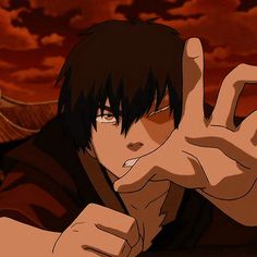 an anime character making the peace sign with his hand while sitting in front of a red sky