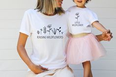 "Raising Wildflowers  Little Wildflower Matching Shirts, Mommy And Me Outfit, Matching Mommy And Me Shirt, Mothers Day Gift From Daughter Join the ranks of stylish comfort with our newest line of Bella Canvas shirts! Made from 100% recycled materials, these simple and trendy shirts are perfect for any occasion. In addition, our high-quality vinyl printing and heat pressing process ensure that your shirt will last through all the wear and tear you can throw at it. So ditch those scratchy, faded o