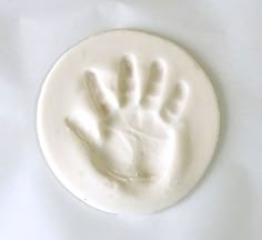 a close up of a soap mold with a hand print on the top and bottom