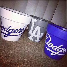 three buckets with dodgers logos on them