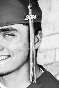 a man wearing a graduation cap and tassel