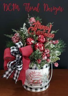 a bucket filled with christmas decorations on top of a table