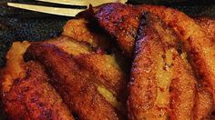 some fried food on a plate with a fork