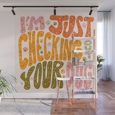 a wall mural that says i'm just checking your paws