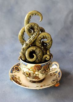 an octopus in a tea cup with saucer