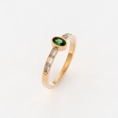 The Bezel Set Vintage Emerald Ring is a timeless expression of elegance and classic beauty. Crafted in 14k Solid Gold, this small oval engagement ring showcases a deep green emerald gemstone in a bezel setting. This ring embodies understated charm, making it an ideal choice for women who appreciate the simplicity and allure of emerald gemstones. Ring Features * 14k Solid Gold (also in 10k,18k ) * Band Options; Yellow Gold, White Gold Rose Gold * Top Width: 6.08x4.23 mm * Band Width: 1.51 mm * Th Timeless Oval Diamond Ring With Baguette Accents, Timeless Oval Diamond Ring With Baguette Diamonds, Classic Oval Diamond Ring With Baguette Diamonds, Timeless Oval Ring With Baguette Diamonds, Timeless Oval Rings With Baguette Diamonds, Oval Baguette Diamond Rings In Timeless Style, Oval Yellow Gold Ring With Baguette Diamonds, Elegant Oval Diamond Ring With Baguette Diamonds, Oval Rings With Baguette Diamonds In 14k Gold