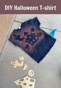 a t - shirt that has been cut out and is laying on the ground