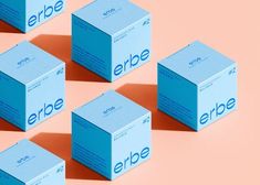 six blue cubes with the word erbe on them against a pink and orange background