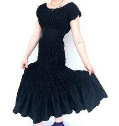 "Gorgeous vintage 1940s black ruched midi dress. So many possibilities with this beauty! Measurements: Bust: Up to 40\" Waist: 28\" Sleeve: 6\" Length: 49\" Modern Size: S/M All measurements are taken with the garment laid flat. Excellent Vintage Condition. All items at Time Warp are vintage, so there is some wear. They may not be 100% free of minor defects, as they have already been loved. We list items by condition and note any flaws. Mint: Unworn Excellent: Previously worn, may have minor fla Black Fitted Dress With Gathered Skirt, Fitted Black Dress With Gathered Skirt, Fitted Black Midi Dress With Pleated Waist, Black Formal Dress With Gathered Skirt, Black Fitted Midi Dress With Gathered Waist, Black Fitted Dress With Gathered Waist, Fitted Black Midi Dress With Gathered Waist, Black Midi Dress With Gathered Waist For Evening, Black Fitted Vintage Midi Dress