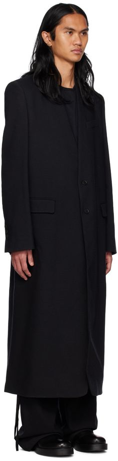 Stretch virgin wool melton coat. · V-neck · Button closure · Flap and welt pockets · Padded shoulders · Four-button surgeon's cuffs · Central vent at back hem · Adjustable button strap at interior · Full sateen lining Supplier color: Black Ann Demeulemeester, Black Body, Welt Pockets, Luxury Streetwear, Welt Pocket, Perfect Clothing, For Men, V Neck, Wool