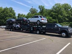 a large truck with several cars on it's flatbed