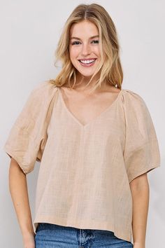 The Shelby Linen Top is the perfect choice for a sophisticated yet comfortable summer look. Crafted from a lightweight linen fabric, this V-Neck top features short sleeves and a waist-length cut, offering an airy feel to any wardrobe. With a timelessly chic silhouette, the Shelby Linen Top is an effortless way to make a statement.Perfect for high summer, style with smocked linen top to wear under and our wide leg linen pants. -Content: 100% Linen -Hand wash cold -Relaxed fit Model wears size S Wide Leg Linen Pants, Lightweight Tops, Summer Look, Linen Top, Waist Length, Linen Pants, V Neck Tops, Summer Looks, Timeless Pieces