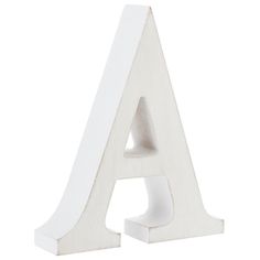 a white wooden letter sitting on top of a table