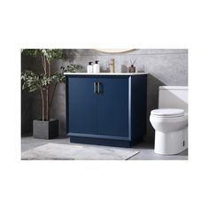 a blue cabinet next to a white toilet in a bathroom with a potted plant