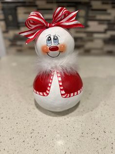 a snowman ornament sitting on top of a counter