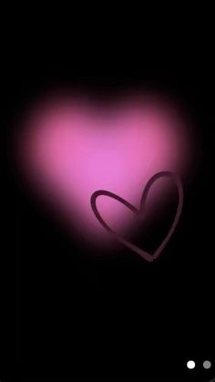 a pink heart on a black background