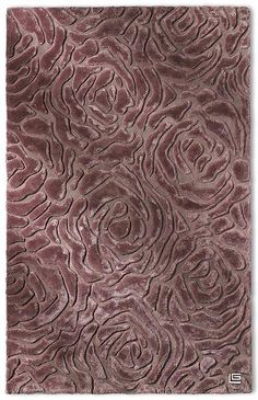 an area rug that has been made to look like it is wavy and rosey