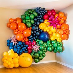 a bunch of balloons that are on the wall