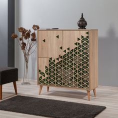 a wooden cabinet sitting on top of a hard wood floor next to a black chair