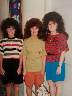 three young women standing next to each other