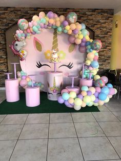 a unicorn themed birthday party with balloons and decorations