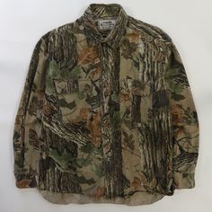 a camo shirt with trees all over it