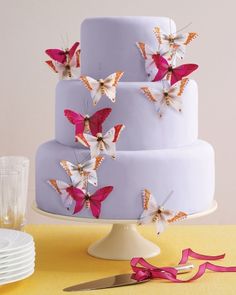 there are many butterflies on the cake